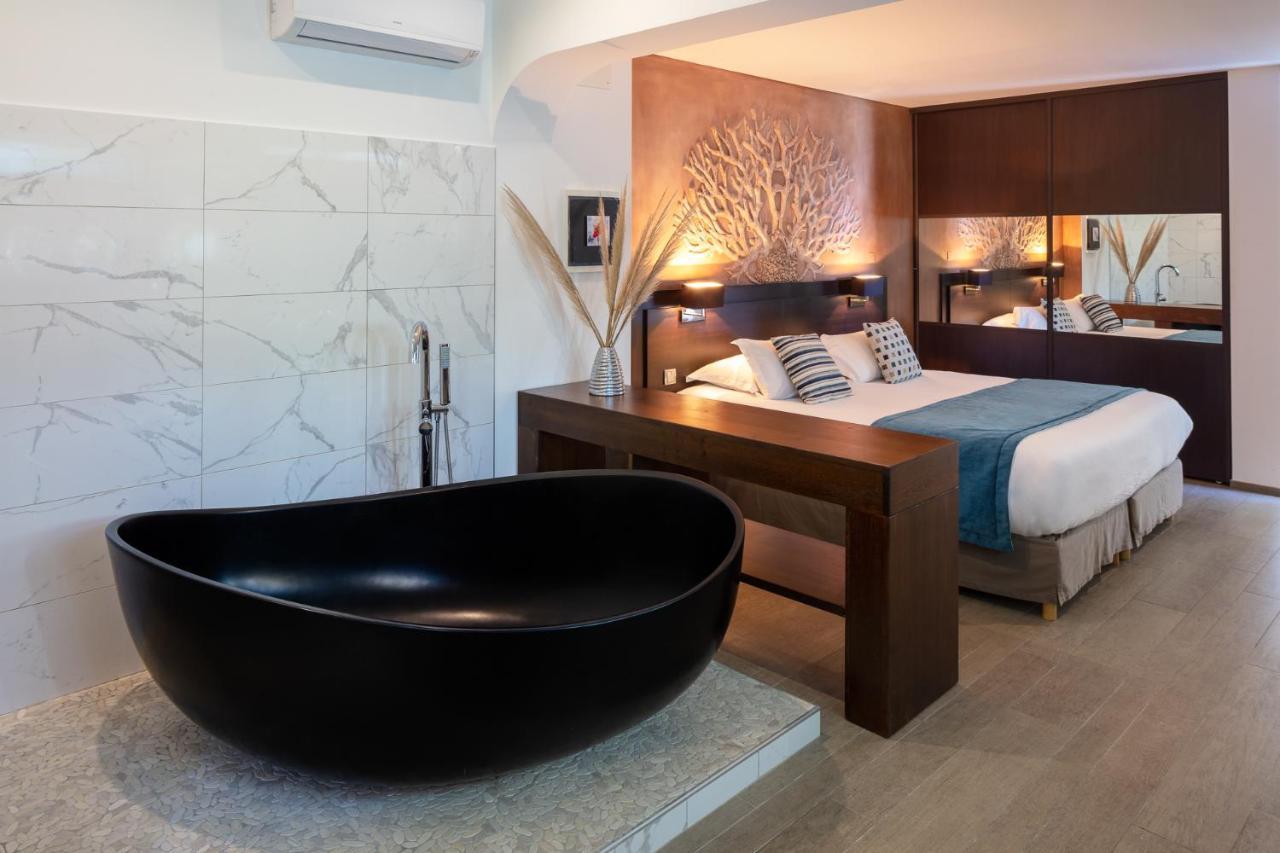 Hotel Le Ruesco Ольмето Экстерьер фото